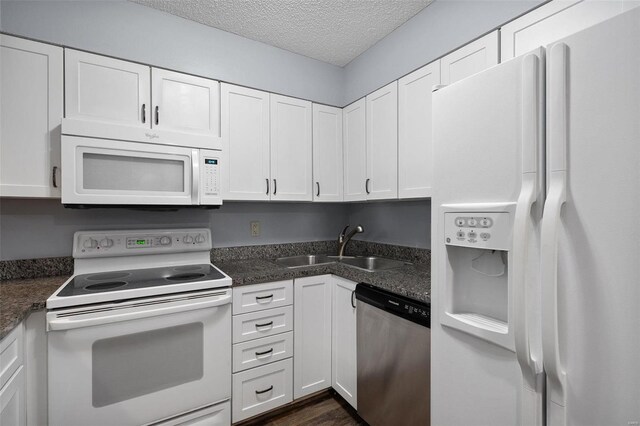 1593 Thrush Ter, Brentwood, MO 63144 - kitchen featuring white appliances, a sink, a textured ceiling, and white cabinets