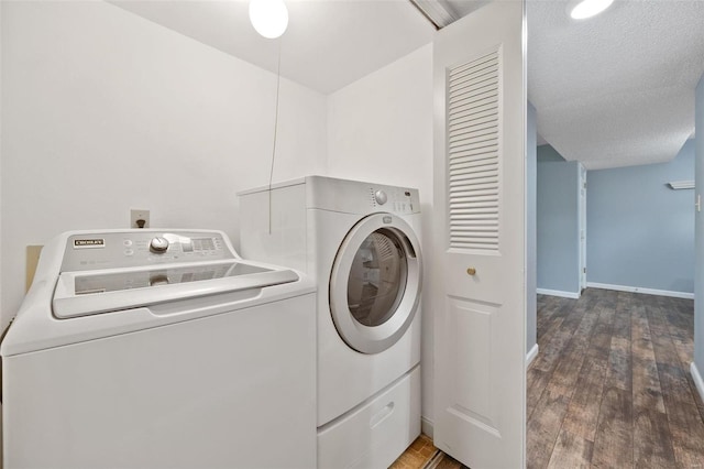 1593 Thrush Ter, Brentwood, MO 63144 - laundry room with washing machine and clothes dryer, wood finished floors, baseboards, and a textured ceiling