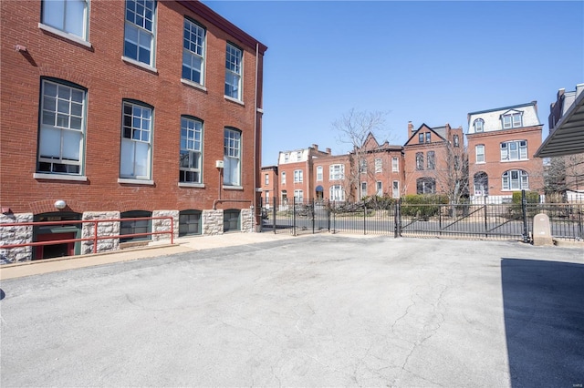 view of property with fence and a residential view