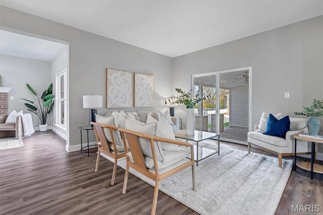 living area with dark wood finished floors and baseboards