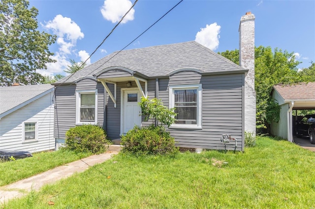 1019 Kinzer, Poplar Bluff, MO 63901 - bungalow featuring a front yard, a chimney, and roof with shingles