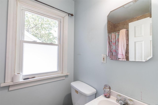 1019 Kinzer, Poplar Bluff, MO 63901 - full bathroom with toilet, a shower with shower curtain, and a sink