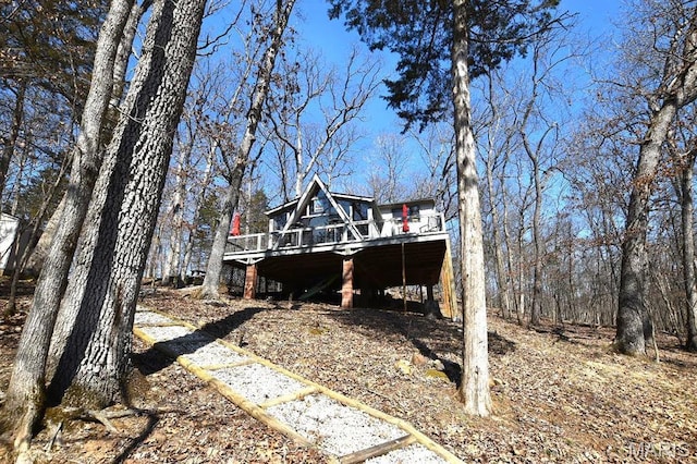 view of home's exterior featuring a wooden deck
