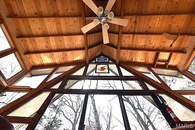 detailed view of wooden ceiling and a ceiling fan