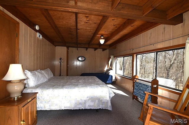 bedroom featuring wood ceiling, wood walls, carpet, and beam ceiling