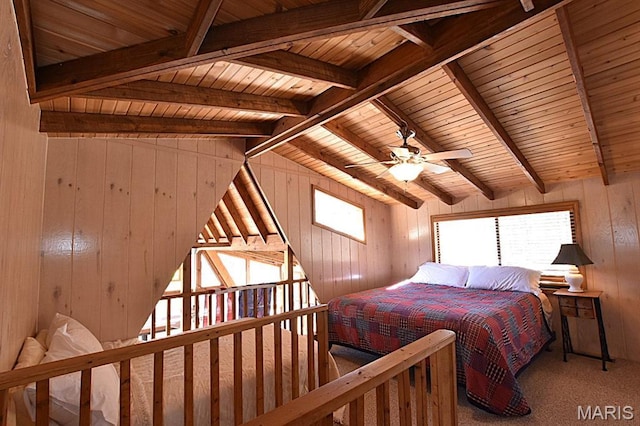 carpeted bedroom with wooden ceiling, wood walls, and multiple windows