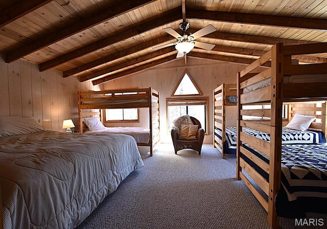 bedroom with wood walls, carpet, and wooden ceiling