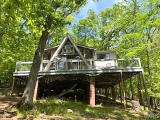 856 Aspen Lake Dr, Innsbrook, MO 63390 - rear view of property featuring a deck and a wooded view