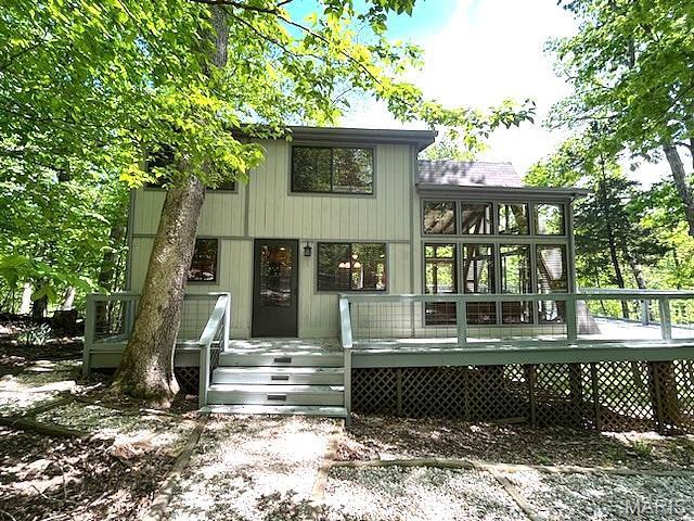 856 Aspen Lake Dr, Innsbrook, MO 63390 - back of property with a wooden deck
