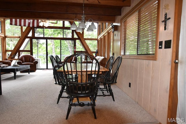 856 Aspen Lake Dr, Innsbrook, MO 63390 - carpeted dining space featuring a chandelier, wood walls, and beam ceiling