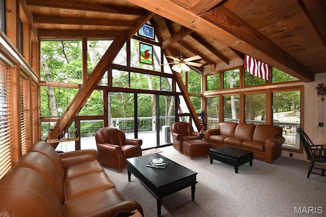 856 Aspen Lake Dr, Innsbrook, MO 63390 - living area with healthy amount of natural light, a wood ceiling with exposed beams, a ceiling fan, high vaulted ceiling, and carpet flooring