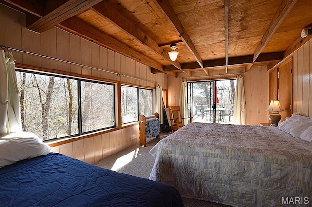 856 Aspen Lake Dr, Innsbrook, MO 63390 - carpeted bedroom with wooden walls, a wood ceiling with exposed beams, and access to outside