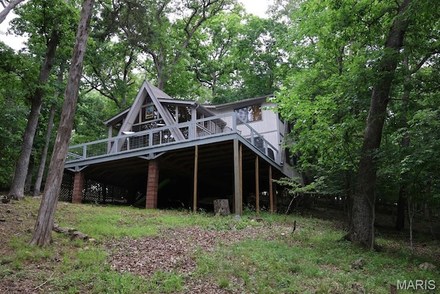856 Aspen Lake Dr, Innsbrook, MO 63390 - back of property with a wooden deck and stairs