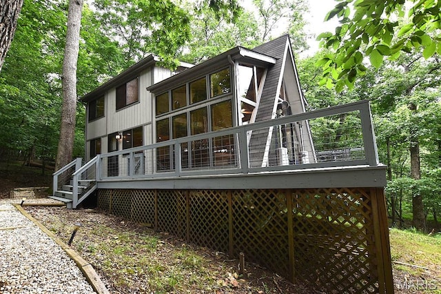 856 Aspen Lake Dr, Innsbrook, MO 63390 - back of property with a wooden deck