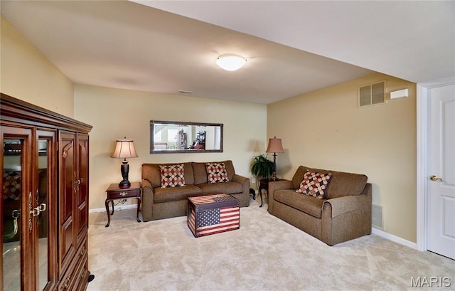 living area featuring light colored carpet and baseboards