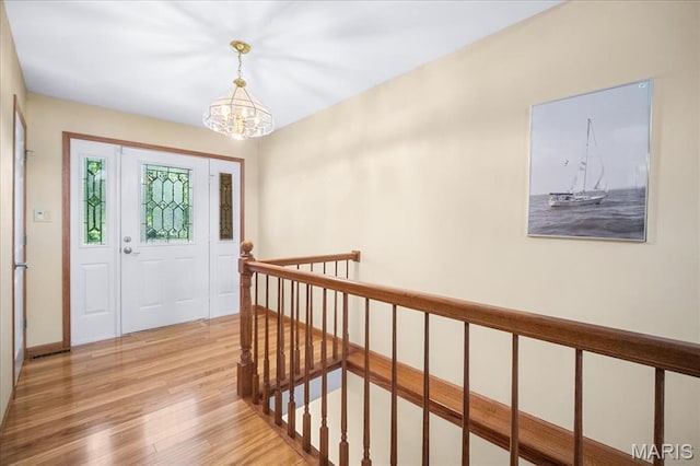 221 Greiner Ct, Ellisville, MO 63021 - entrance foyer featuring a chandelier and light wood-style flooring