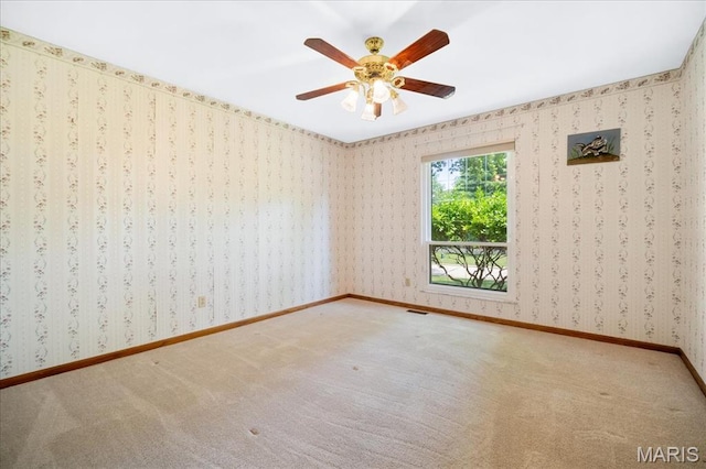221 Greiner Ct, Ellisville, MO 63021 - carpeted empty room with a ceiling fan and wallpapered walls