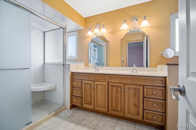 221 Greiner Ct, Ellisville, MO 63021 - bathroom with tile patterned flooring, double vanity, and a stall shower