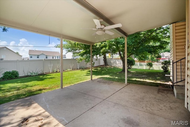 221 Greiner Ct, Ellisville, MO 63021 - fenced backyard featuring a ceiling fan and a patio