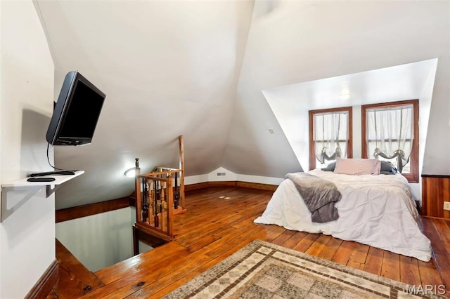 502 W 5th St, Washington, MO 63090 - bedroom featuring wood-type flooring, vaulted ceiling, and baseboards