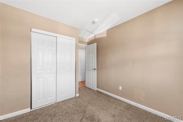8724 Santa Bella Dr Unit G, Hazelwood, MO 63042 - unfurnished bedroom with baseboards, carpet, and a closet