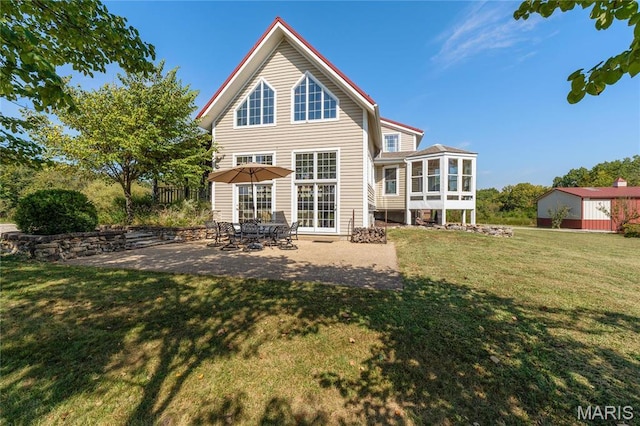 507 Leach Branch Rd, Hermann, MO 65041 - back of property with a patio area, a sunroom, and a yard