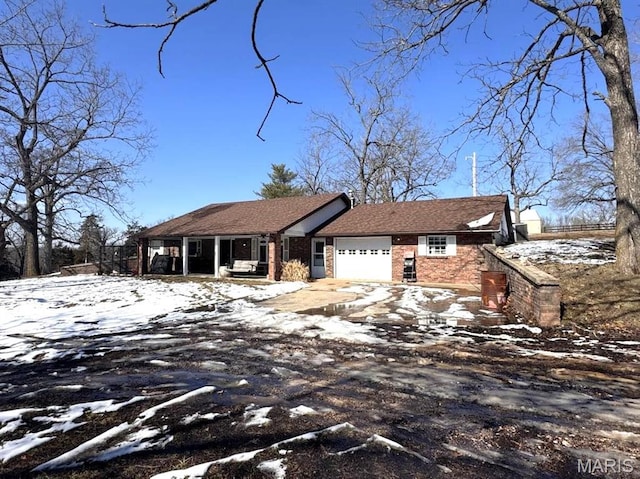 27409 Missouri Dr, Lebanon, MO 65536 - ranch-style house with an attached garage and brick siding