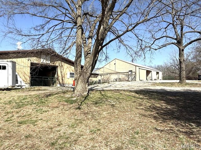 27409 Missouri Dr, Lebanon, MO 65536 - view of yard with an outdoor structure and an outbuilding