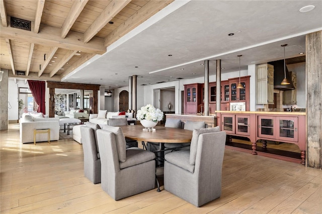 150 Carondelet Unit 2901, Saint Louis, MO 63105 - dining space featuring light wood-type flooring and beam ceiling