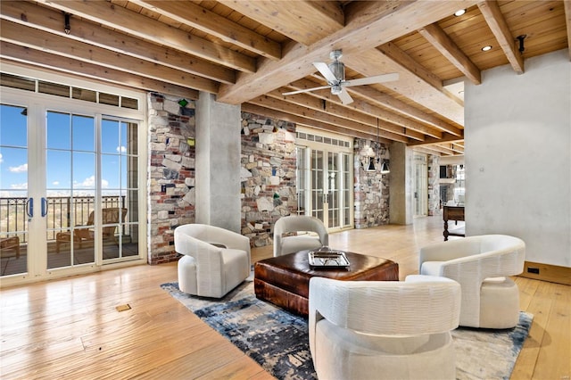 150 Carondelet Unit 2901, Saint Louis, MO 63105 - living room with wooden ceiling, a ceiling fan, beam ceiling, and wood-type flooring