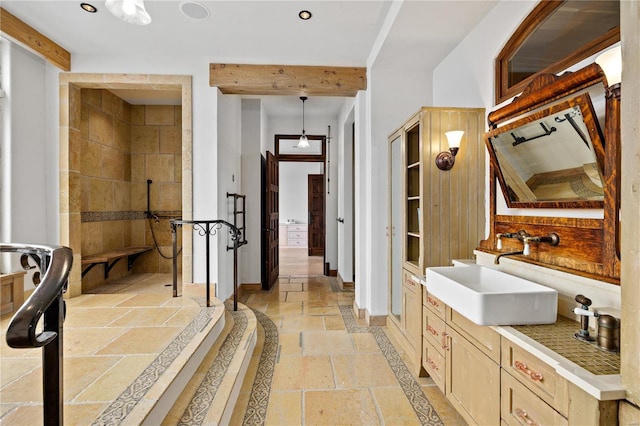 150 Carondelet Unit 2901, Saint Louis, MO 63105 - full bathroom featuring stone tile flooring, a walk in shower, vanity, baseboards, and recessed lighting