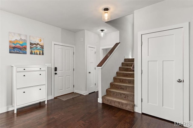 3208 Henrietta St, Saint Louis, MO 63104 - entrance foyer featuring dark wood finished floors, stairs, and baseboards