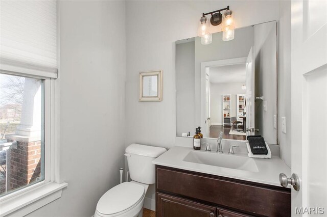 3208 Henrietta St, Saint Louis, MO 63104 - half bathroom with toilet and vanity