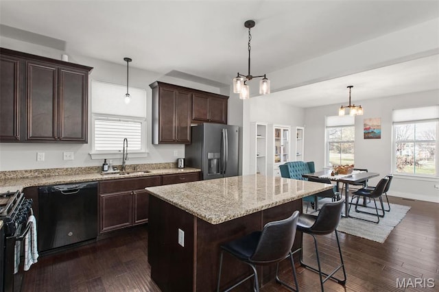 3208 Henrietta St, Saint Louis, MO 63104 - kitchen featuring black appliances, a sink, dark brown cabinets, light stone counters, and dark wood-style floors