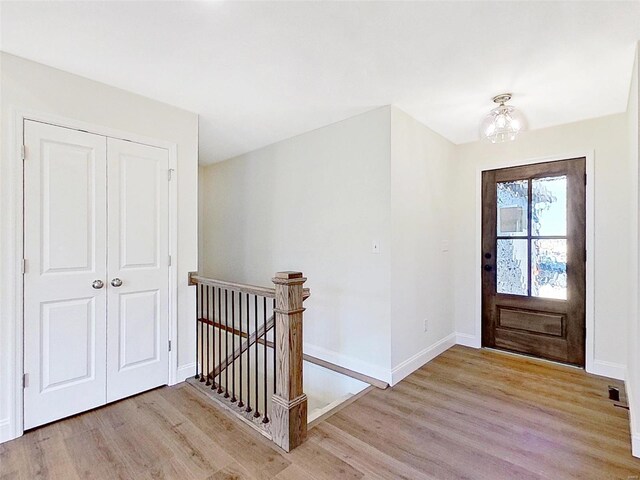 220 Great Bear Pass, Foristell, MO 63348 - foyer entrance with light wood-style flooring, baseboards, and a chandelier