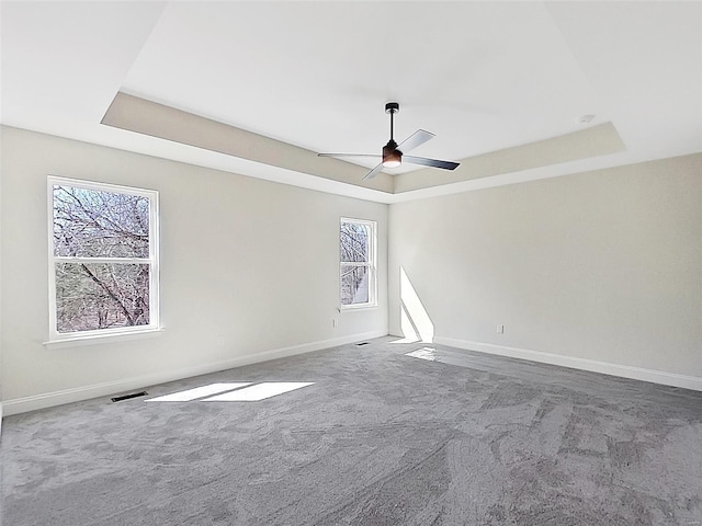 220 Great Bear Pass, Foristell, MO 63348 - carpeted empty room featuring a tray ceiling and baseboards