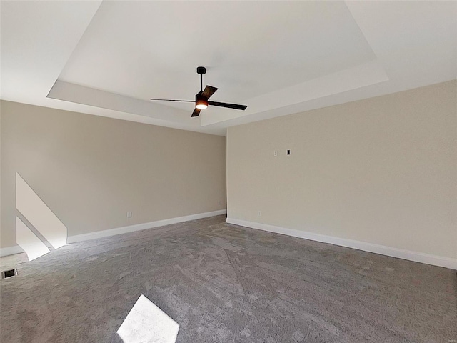 220 Great Bear Pass, Foristell, MO 63348 - carpeted spare room with a tray ceiling, baseboards, and a ceiling fan