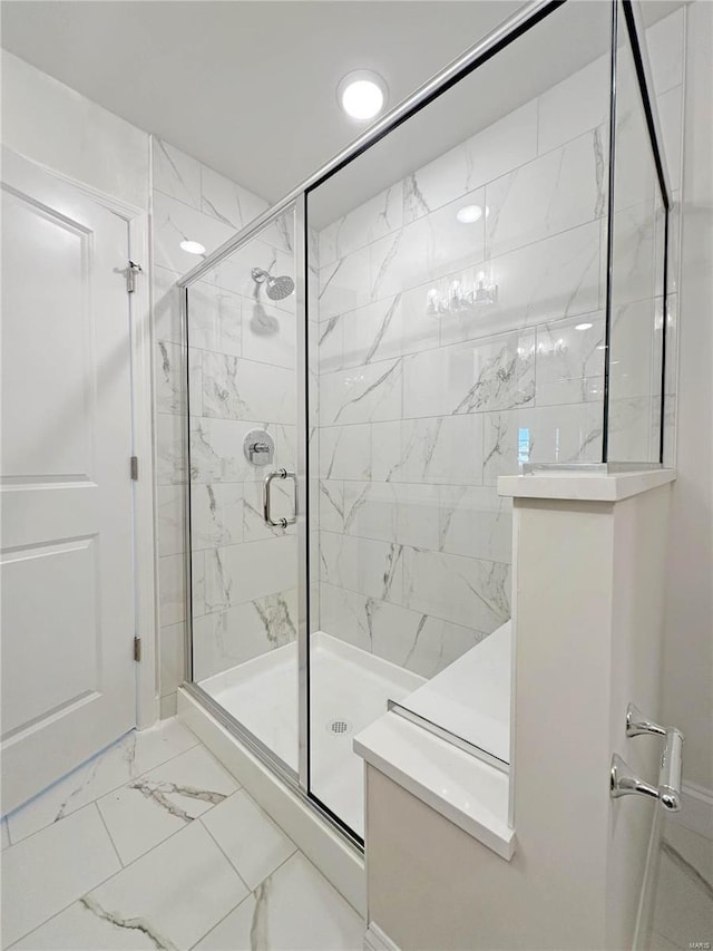 220 Great Bear Pass, Foristell, MO 63348 - bathroom featuring a marble finish shower, marble finish flooring, and recessed lighting