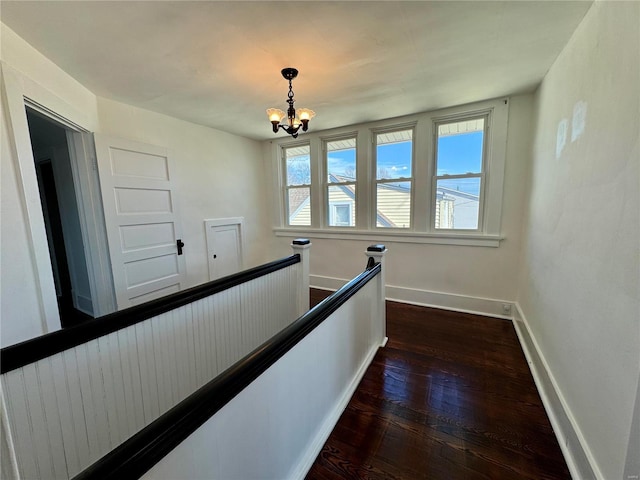 1522 E 5th St, Washington, MO 63090 - hallway featuring an upstairs landing, a chandelier, baseboards, and dark wood-style floors