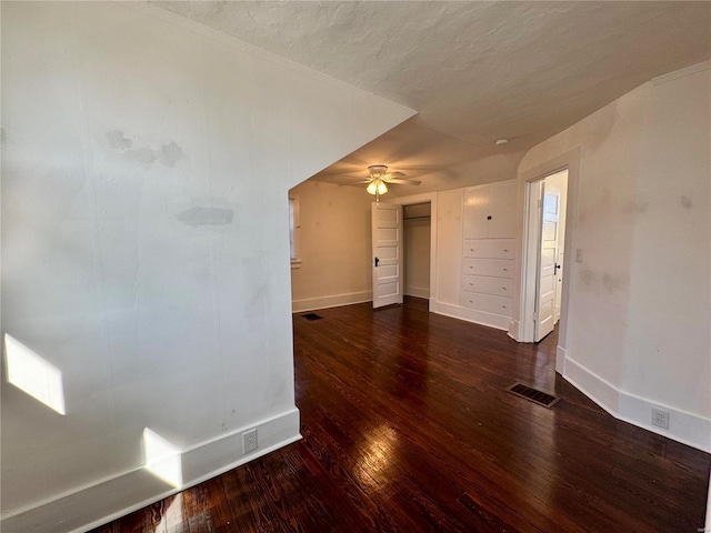 1522 E 5th St, Washington, MO 63090 - spare room featuring wood-type flooring, baseboards, a ceiling fan, and a textured ceiling