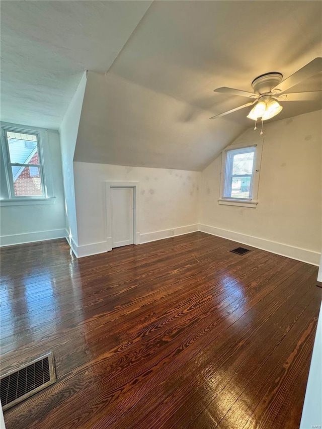 1522 E 5th St, Washington, MO 63090 - additional living space with lofted ceiling, ceiling fan, baseboards, and dark wood-style floors