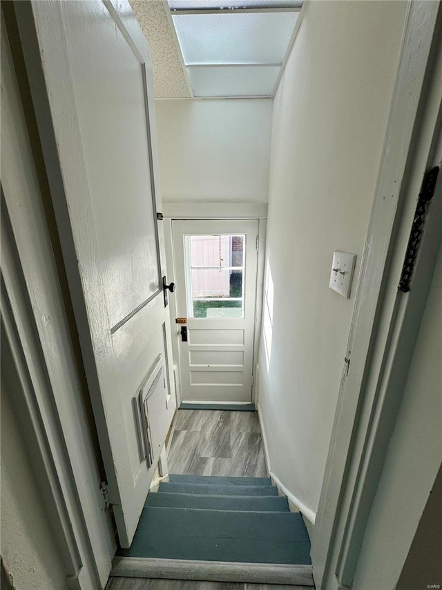 1522 E 5th St, Washington, MO 63090 - staircase with wood finished floors and baseboards