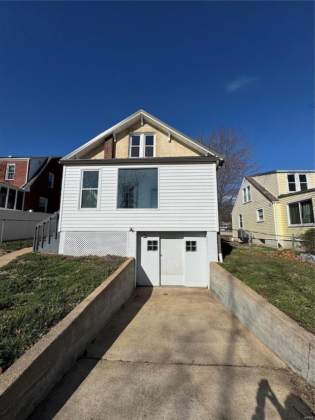 1522 E 5th St, Washington, MO 63090 - view of front of property featuring a garage, concrete driveway, and central AC