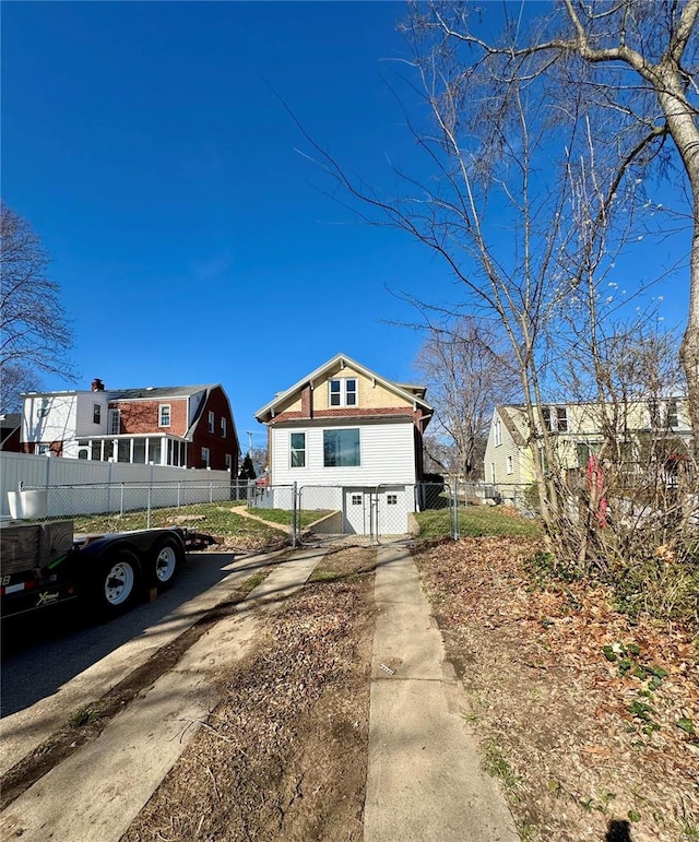 1522 E 5th St, Washington, MO 63090 - view of side of home with a gate and a residential view