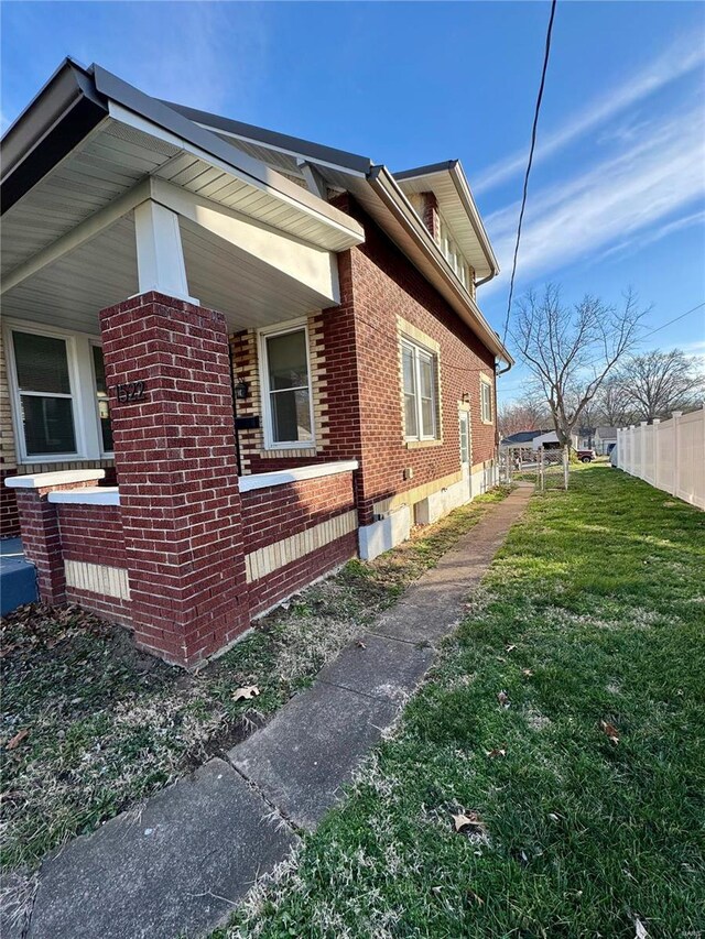 1522 E 5th St, Washington, MO 63090 - view of home's exterior featuring brick siding