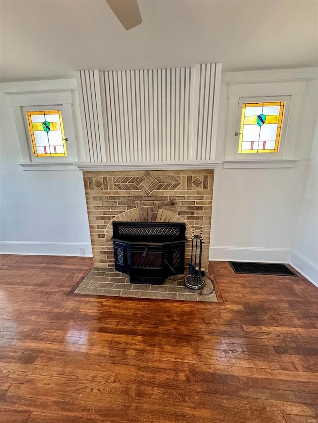 1522 E 5th St, Washington, MO 63090 - unfurnished living room featuring hardwood / wood-style flooring and baseboards