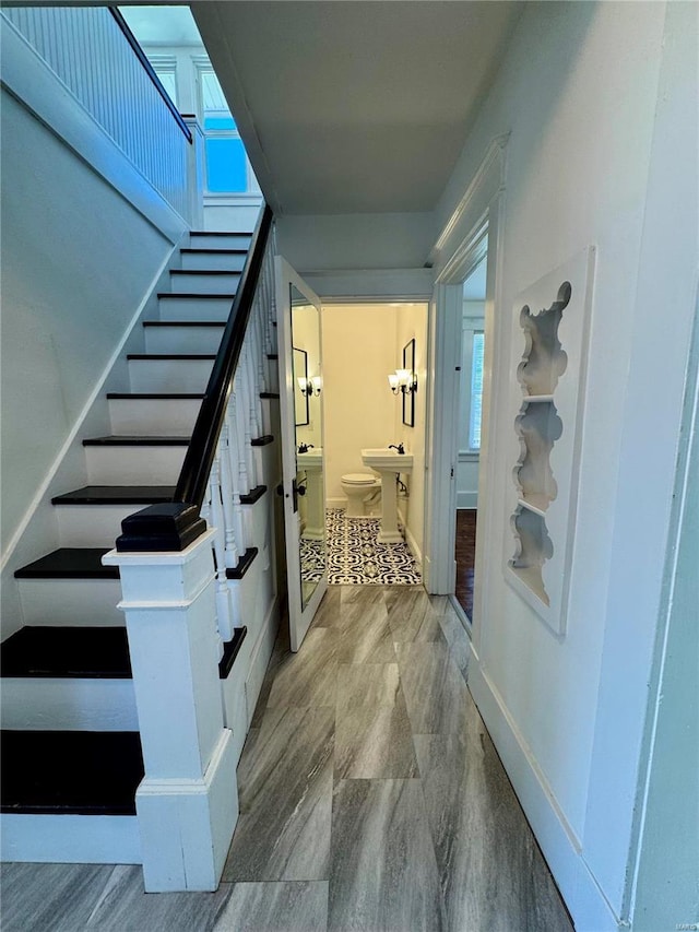 1522 E 5th St, Washington, MO 63090 - staircase featuring baseboards, plenty of natural light, and wood finished floors