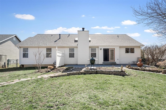 rear view of property featuring a patio area and a chimney