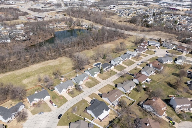 aerial view of property's location featuring nearby suburban area and a nearby body of water