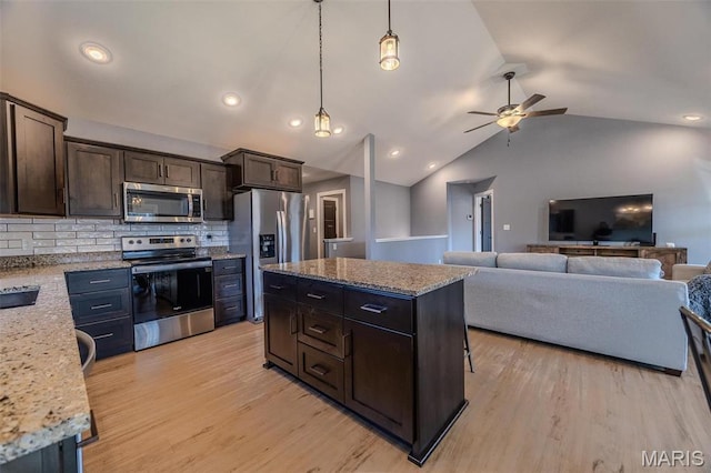 117 Alice Dr, Waynesville, MO 65583 - kitchen featuring appliances with stainless steel finishes, ceiling fan, dark brown cabinetry, backsplash, and lofted ceiling